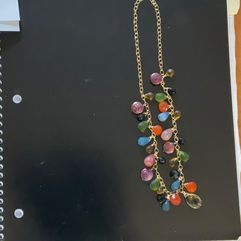 Beautiful gold necklace with coin pearls and multiple colored stones